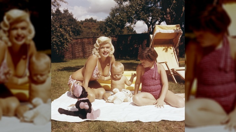 Jayne Mansfield in the garden with her baby son Miklos and daughter Jayne Marie, circa 1959