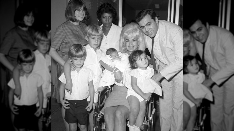 Actress Jayne Mansfield and family are pictured here as the blonde actress leaves Cedars of Lebanon Hospital with the newest addition to the family, baby Anthony. Left to right are Jayne Marie Mansfield, 15, Zoltan Hargitay, 5, Mickey Hargitay Jr., 6, unidentified hospital attendant, Jayne holding baby Anthony, and husband Matt Cimber with Mariska Hargitay, 1. Anthony is the first child by Cimber.