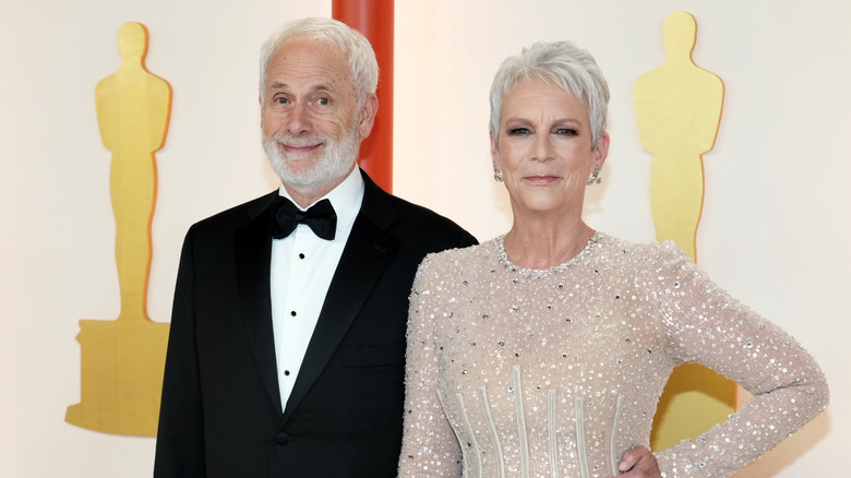 Christopher Guest and Jamie Lee Curtis attend the 95th Annual Academy Awards on March 12, 2023 in Hollywood, California.