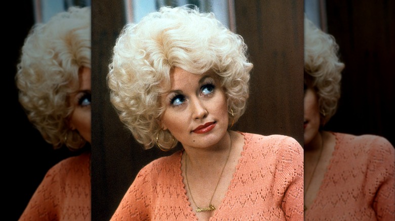Dolly Parton in a short curly bob on set for the "9 to 5" movie