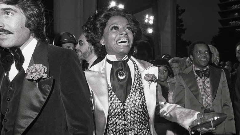 Diana Ross smiling as she enters the 1973 Academy Awards