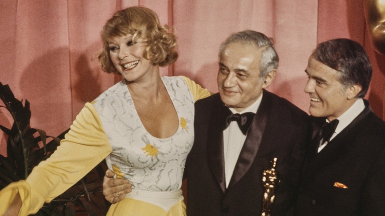 Elke Sommer posing with an Academy Award at the 1973 Oscars