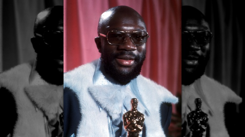 Isaac Hayes holding his trophy backstage at the 1972 Oscars