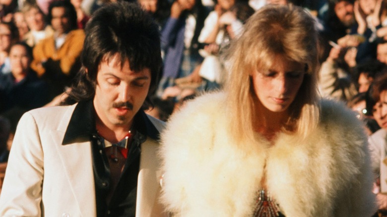 Paul and Linda McCartney walking down the red carpet at the 1974 Oscars