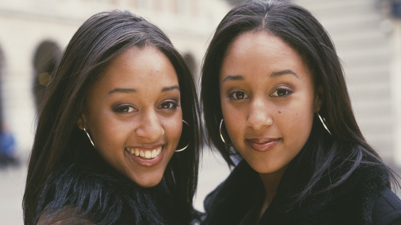 Tia and Tamera Mowry posing