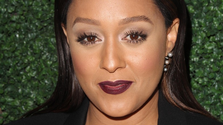 Tia Mowry wearing dark lipstick