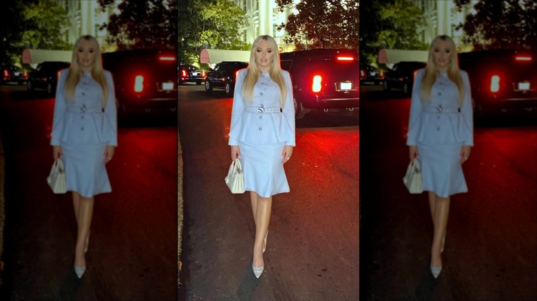 Tiffany Trump dressed in baby blue set standing in front of White House