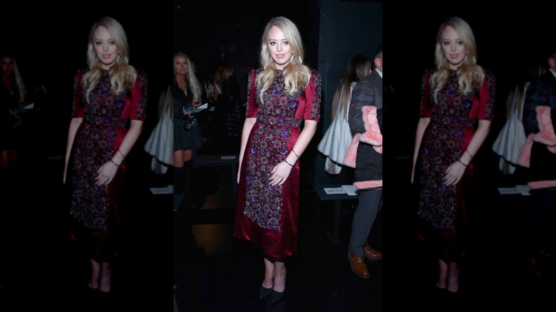 Tiffany Trump in a darkened room wearing a red beaded dress