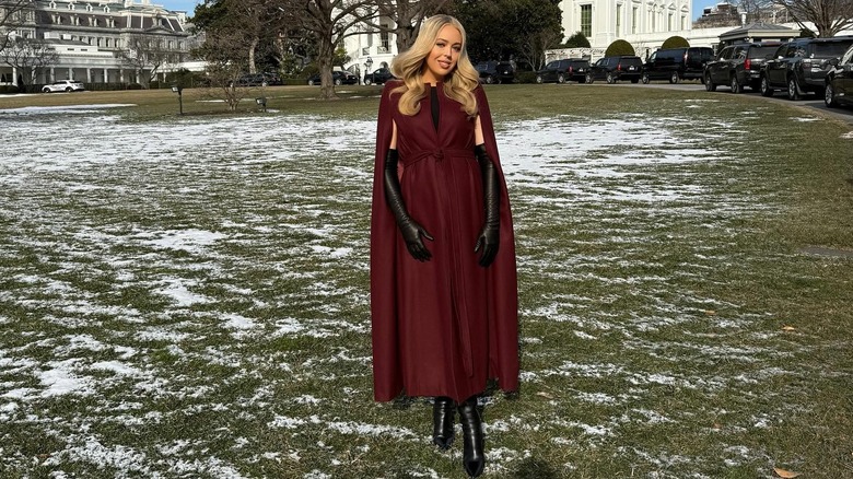 Tiffany Trump posing on snowy White House lawn in burgundy cape coat