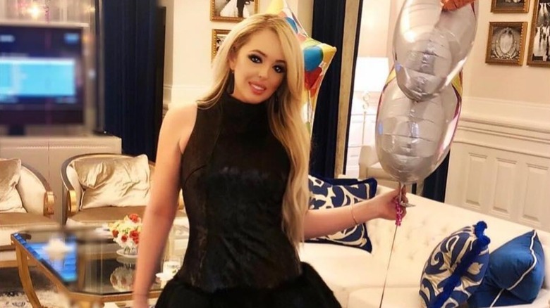 Tiffany Trump smiles while holding balloons during her birthday celebration (2018)