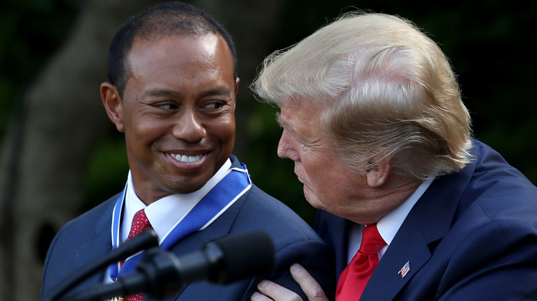 Tiger Woods looking at Donald Trump