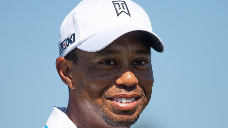 Tiger Woods smiles on the red carpet