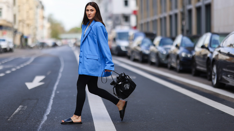 Woman walking down the street in sandals