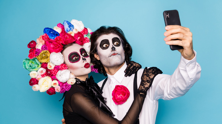 couple taking selfie Halloween costumes