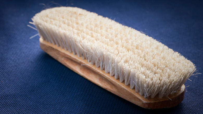 A wooden scrub brush