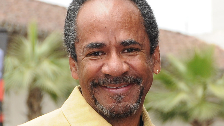 Tim Reid with gold hoop earing