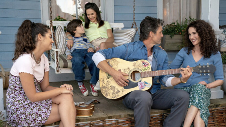 Cast of The Way Home sitting on a porch