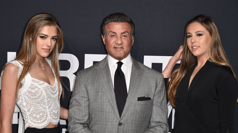 Sylvester Stallone posing with his daughters