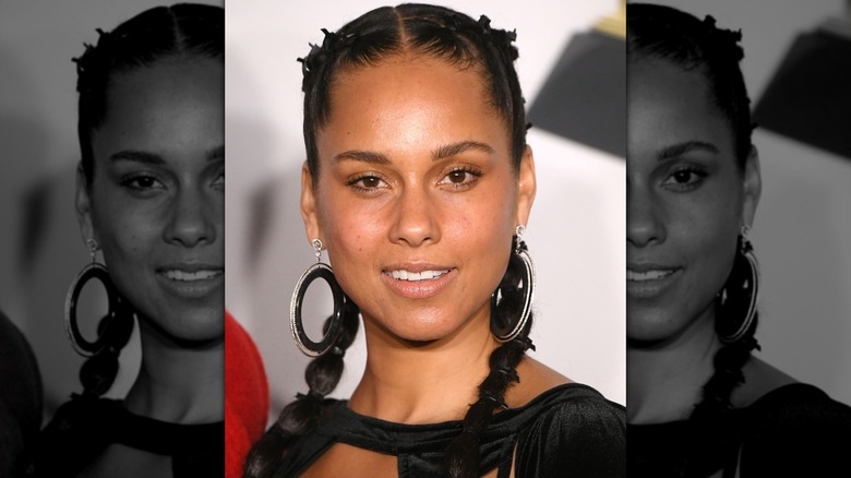 Alicia Keys in braided hair and big hoops