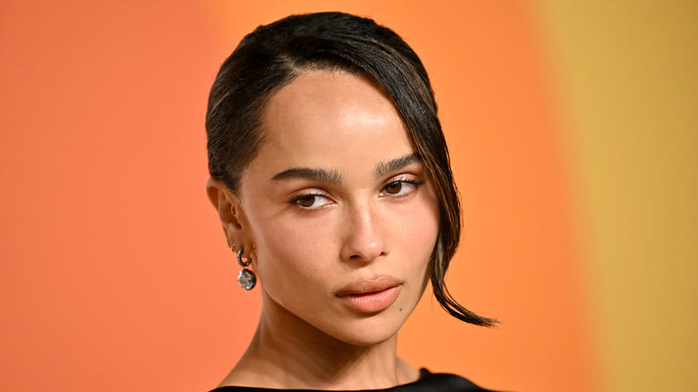 Zoe Kravitz with minimal makeup and sleek bun
