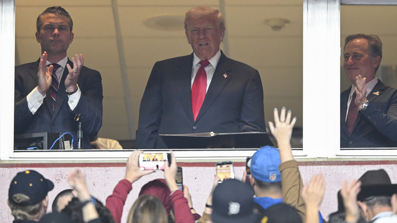 Pete Hegseth, Donald Trump and Commanders team owner Josh Harris attend the NFL football game between the Detroit Lions and Washington Commanders at Northwest Stadium on November 9, 2025 in Landover, Maryland.