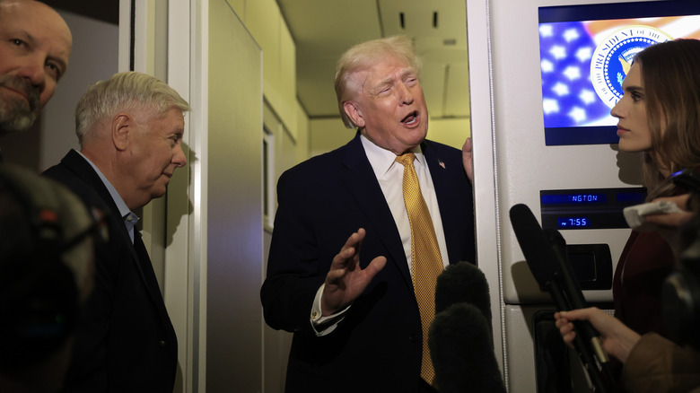 Donald Trump speaking to reporters on Air Force One