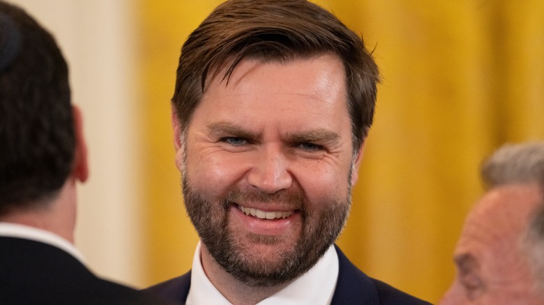 JD Vance smiling at the camera