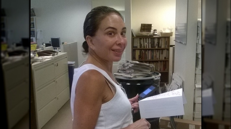 Judge Jeanine Pirro without makeup and with her hair pulled back smiling at the camera
