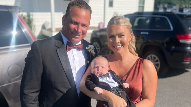 Nicholas Riccio, Karoline Leavitt, and their baby pose for a photo (2024)
