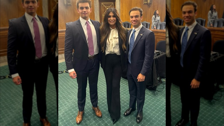 Kimberly Guilfoyle smiling in a picture while wearing a dark suit and white blouse at the capitol hill.