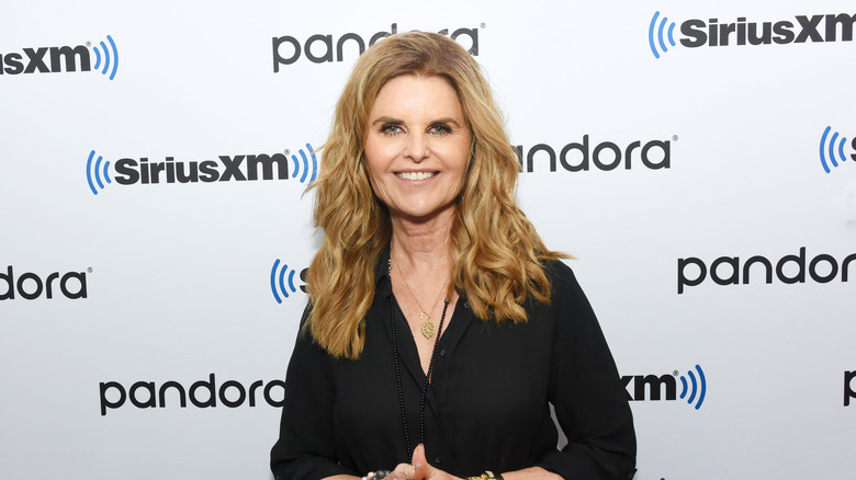 Maria Shriver smiling in black dress