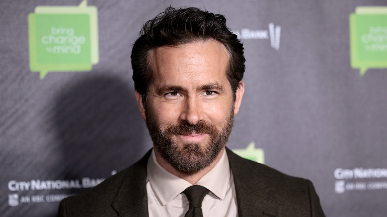 Ryan Reynolds posing for photos