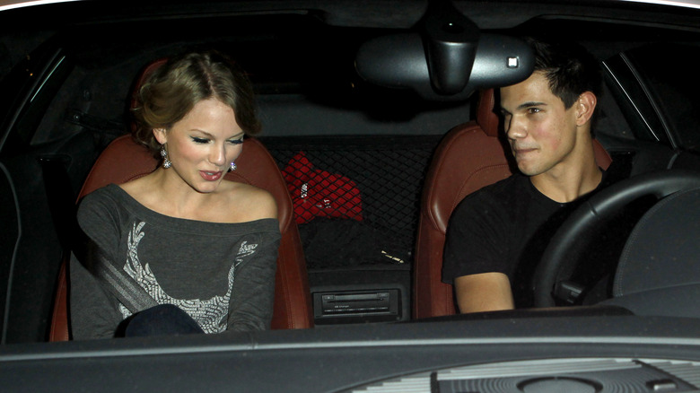 Taylor Swift and Taylor Lautner talking in a car