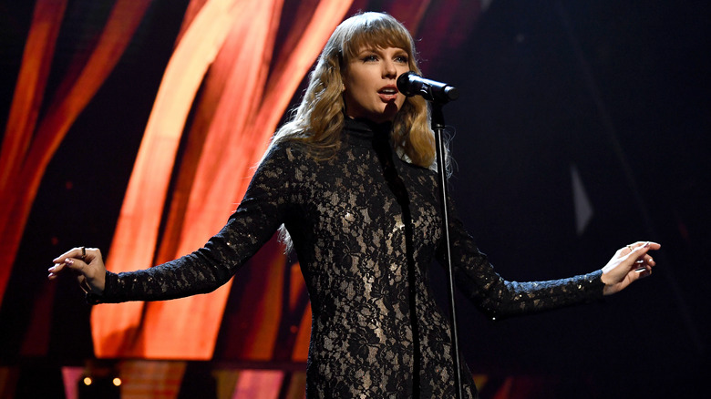 Taylor Swift performing at the 2021 Rock & Roll Hall of Fame ceremony