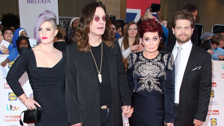 The Osbourne family posing for pictures 