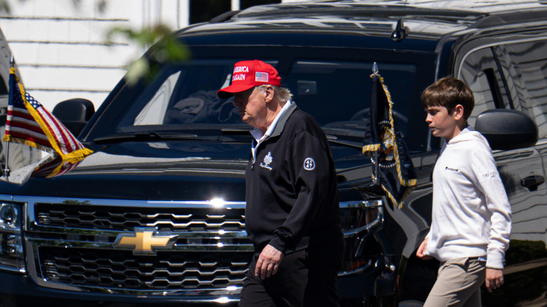 Donald Trump MAGA hat side view motorcade