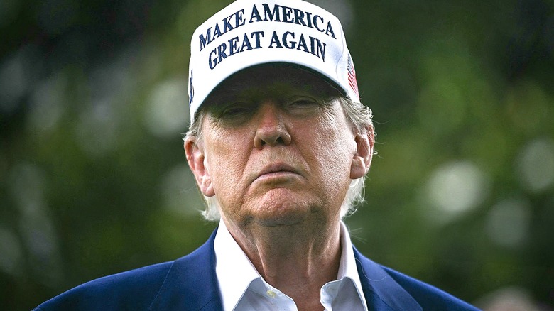 Donald Trump in white MAGA hat