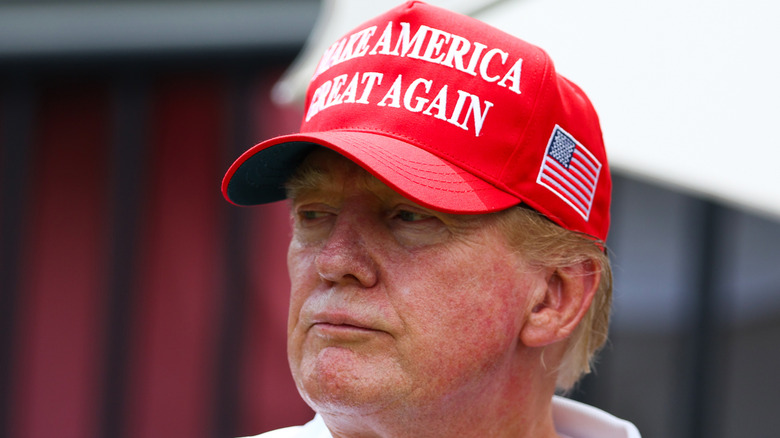 Donald Trump baseball cap red patches on face