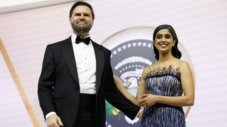 JD Vance smirking and Usha Vance smiling