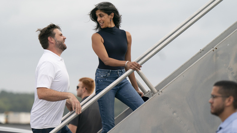 Usha Vance looking over her shoulder to talk to JD Vance