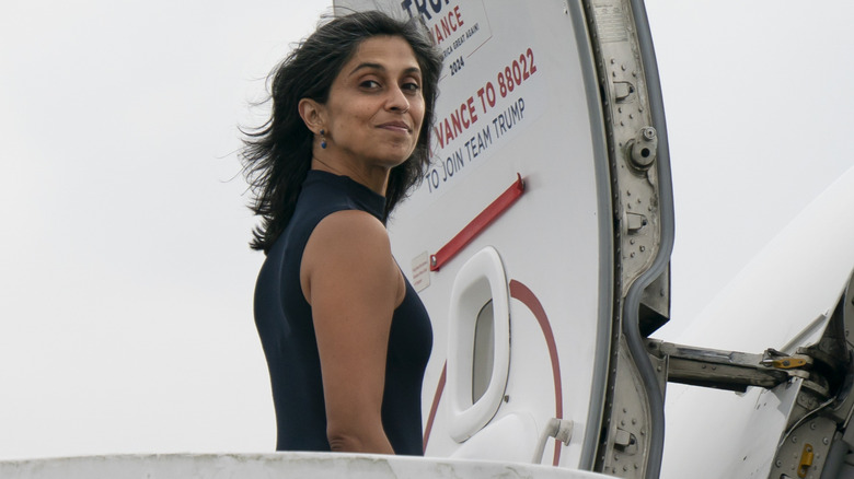 Usha Vance looking over her shoulder as she boards a plane