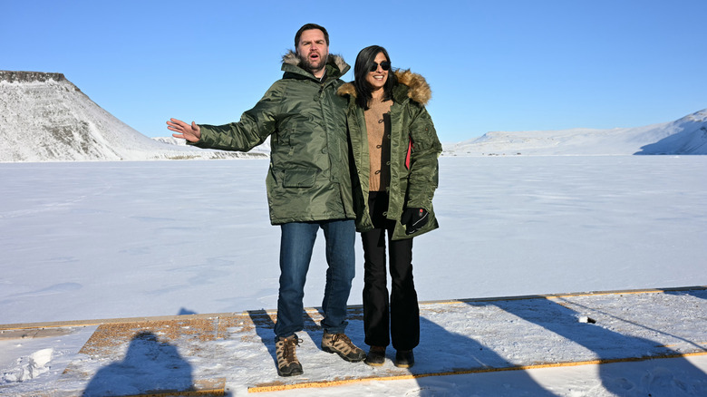 Usha Vance smiling next to JD Vance making an odd face while visiting Greenland
