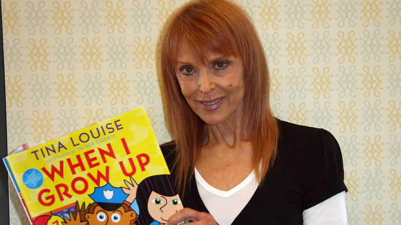 Tina Louise smiling at a 2007 signing event for her book, "When I Grow Up"