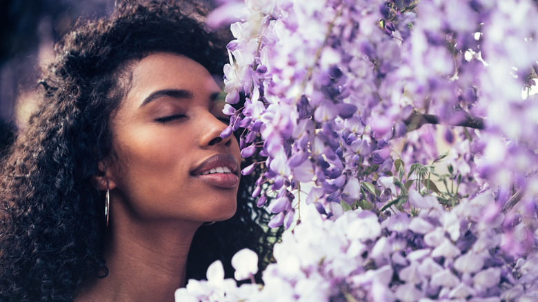 Woman smelling flowers