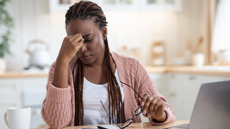 woman upset in front of computer