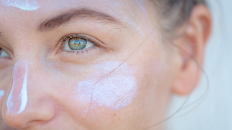 Woman's face with sunscreen