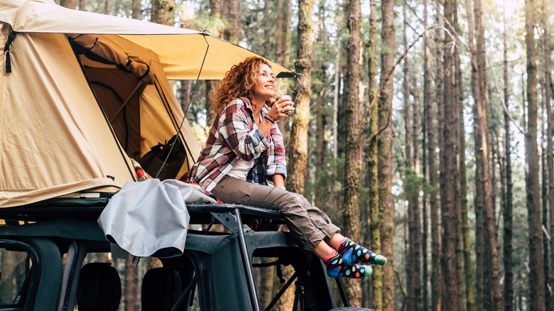Woman in woods camping 