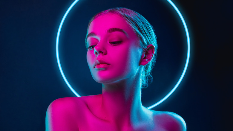 person at night in bright light and makeup