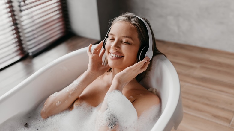 Woman Enjoying Music in a Bath 