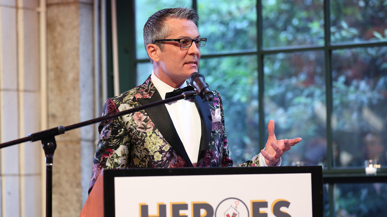 Randy Fenoli showing off bridal gowns